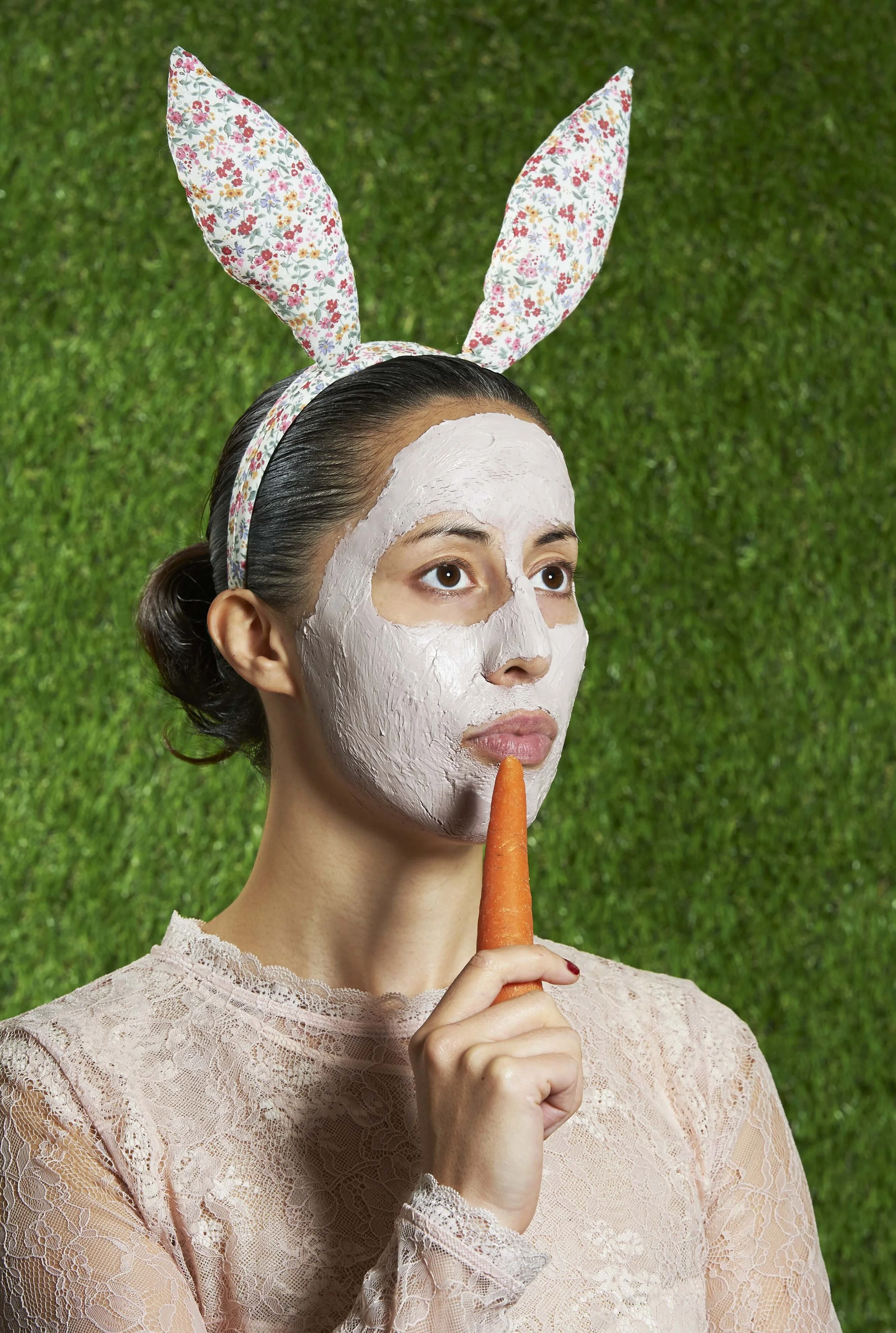 Image of a woman with bunny ears and a carrot