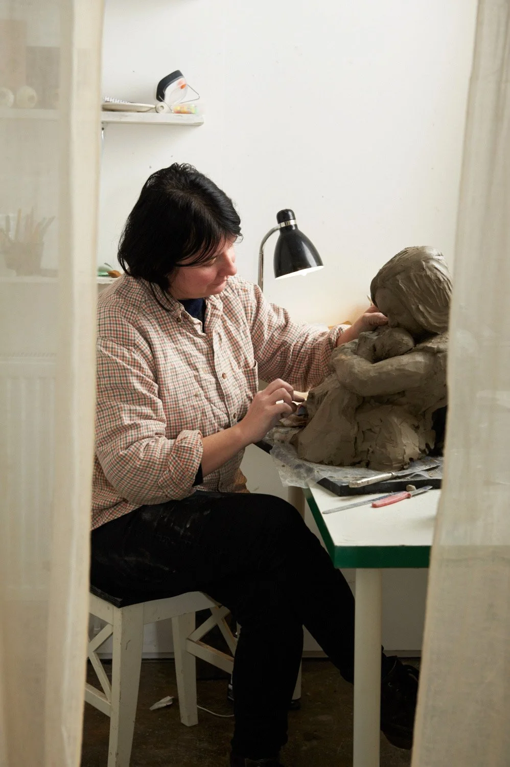 Dominika Kieruzel sculpting a Head and shoulders in clay