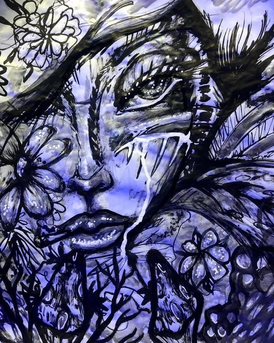 A black and white abstract illustration of a woman's face with flowers, butterflies, and leaves surrounding her. The artwork has a mix of ink-like strokes and watercolor effects, with shades of purple and blue.