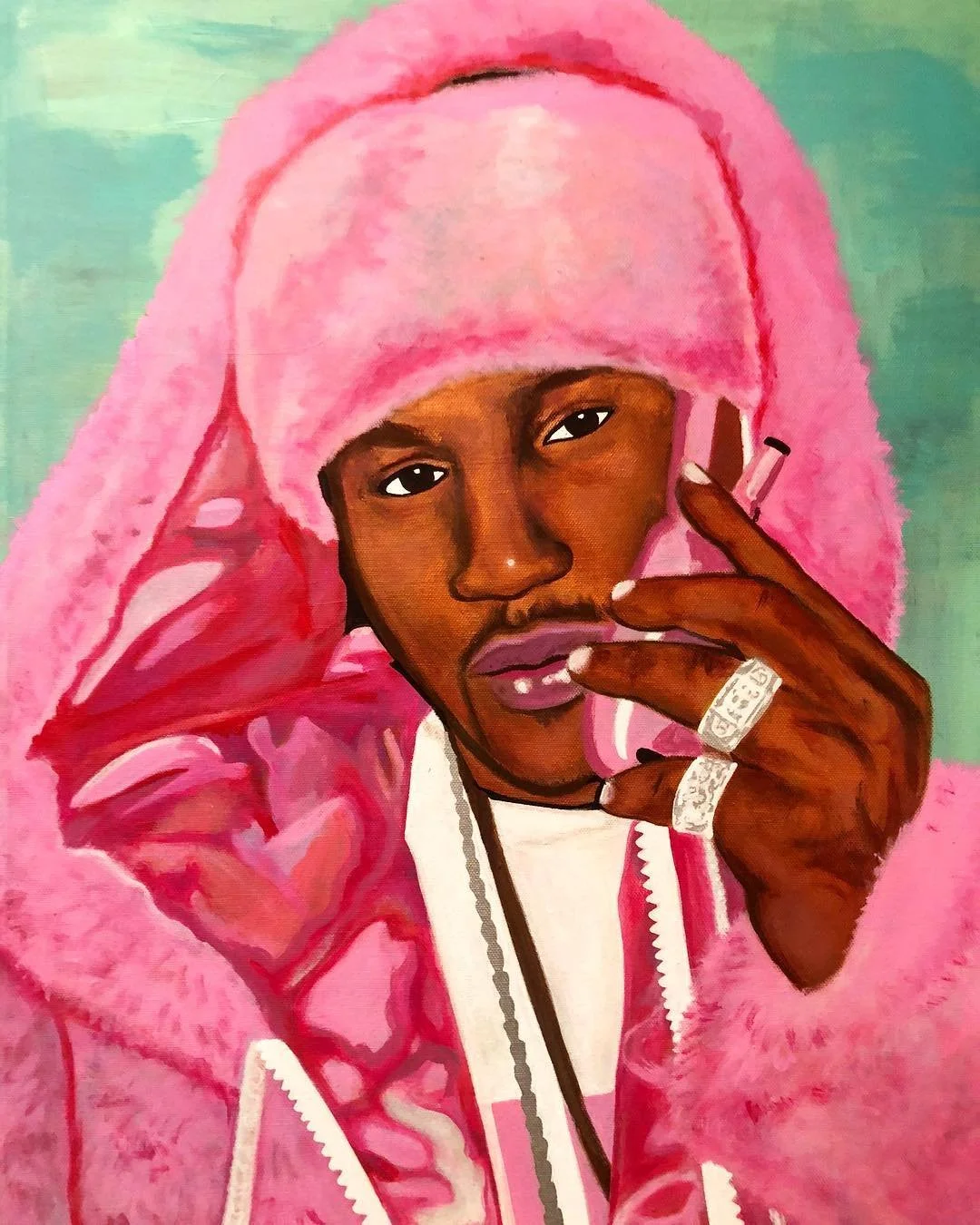 Portrait of a young man with dark skin wearing a pink fur coat and matching pink hat, holding a cigarette near his mouth.