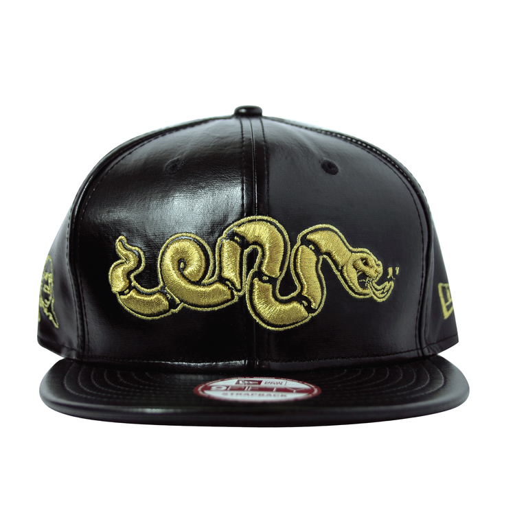 Black leather snapback cap with gold embroidered snake design on the front.