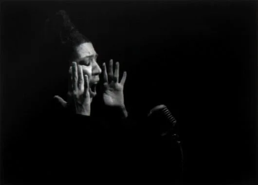 Shirin-Neshat-Turbulent-1998-black-and-white-video-installation-1-2-scaled.jpg