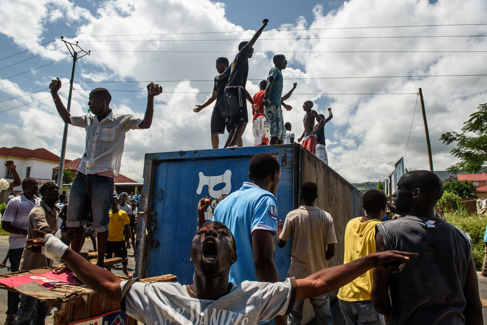  Protestors cheer after erecting a barricade out of shipping container and pushing back the police. Demonstrations protesting incumbent president Pierre Nkurunziza's bid for a 3rd term continued in Bujumbura, Burundi on 13 May 2015. 