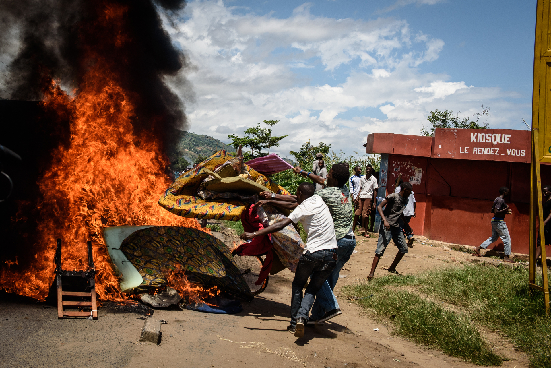  People burn mattresses looted from the local police post in Musaga on 13 May Demonstrations protesting incumbent president Pierre Nkurunziza's bid for a 3rd term continued in Bujumbura, Burundi on 13 May 2015. In the neighborhood of Musaga, hundreds