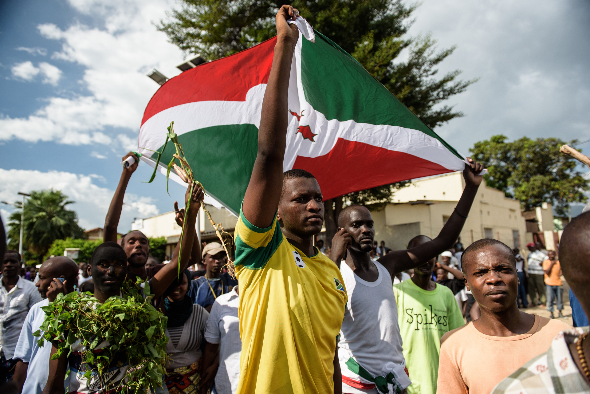  Following the radio announcement by Major General Godefroid Niyombare that President Nkurunziza was overthrown, people took to the streets to celebrate, waving branches, beeping car horns, and parading through Bujumbura on 13 May. 