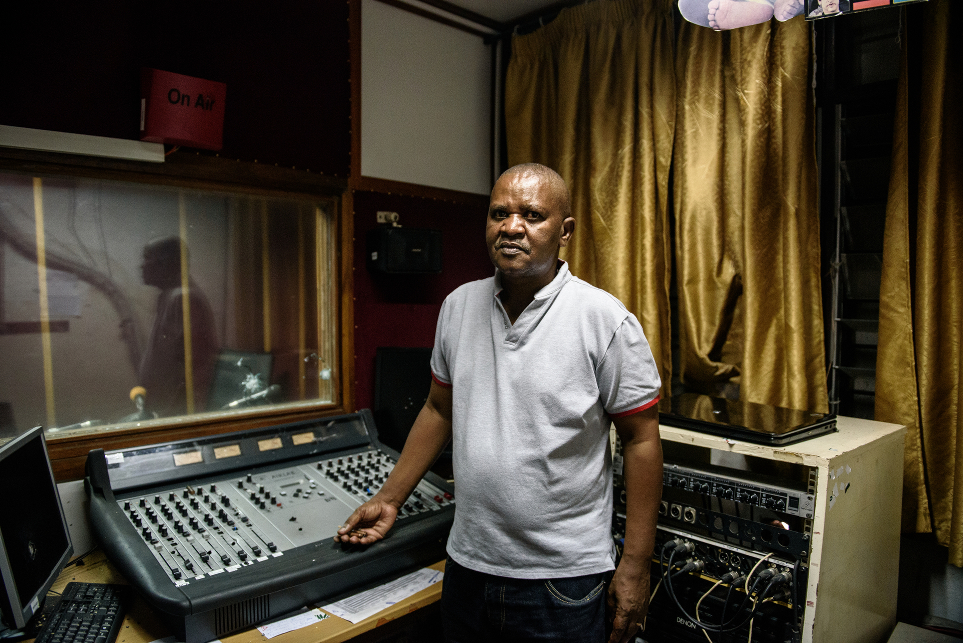  Chief editor of Bonesha radio Leon Masango, in the recording studio that was shot up by security forces during the night of 13-14 May during a coup attempt in Bujumbura, Burundi. 
He said, "I feel sad and angry about what happened. Security forces t