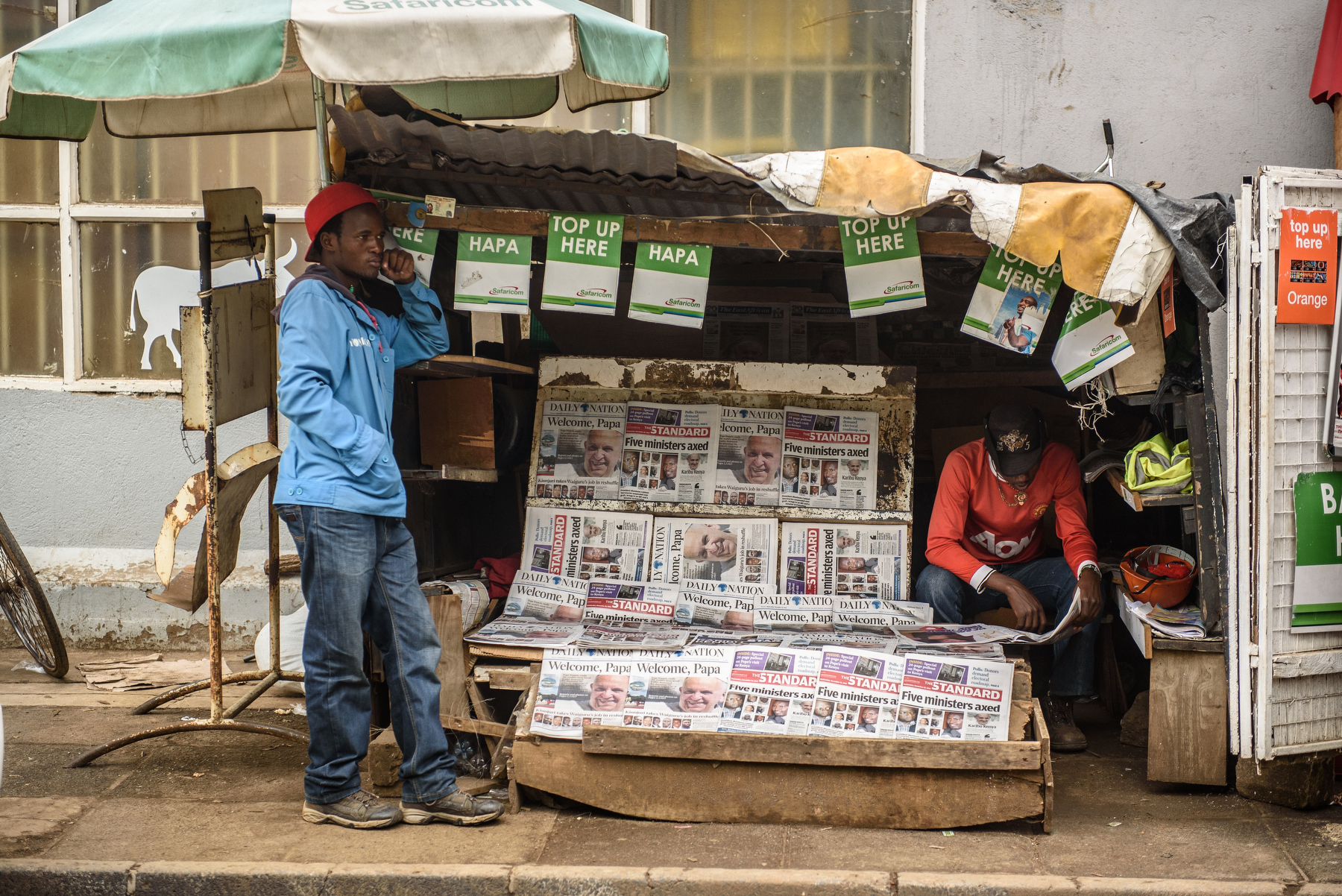  A man reads Kenya's newspaper the Daily Nation in Nairobi on 25 November 2015.Pope Francis is on a five-day visit to Kenya, Uganda and Central African Republic (CAR). AFP PHOTO/Jennifer Huxta
 