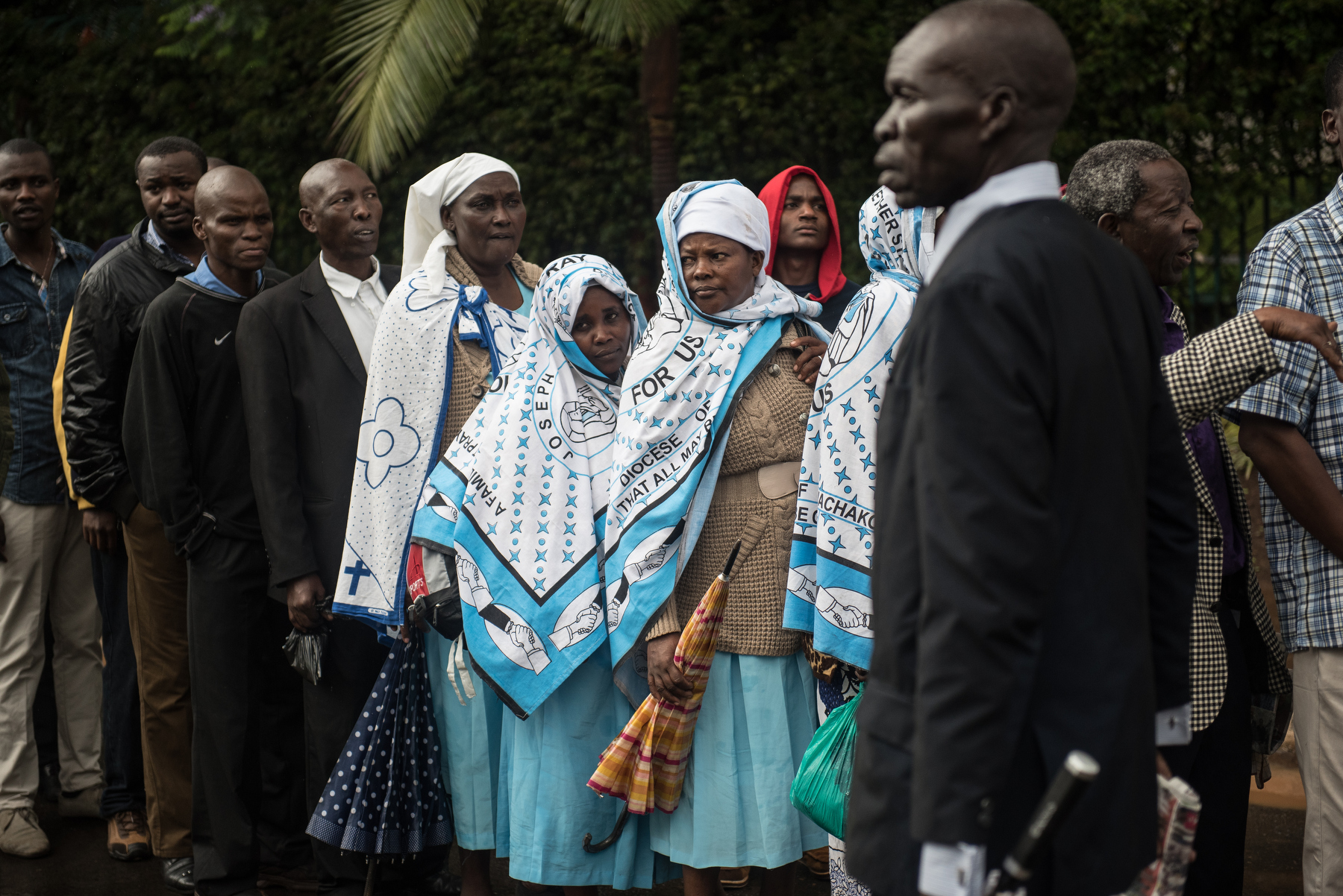  Kenyans wait to enter the University of Nairobi grounds for Pope Francis's holy mass on 26 November 2015. Pope Francis is on a five-day visit to Kenya, Uganda and Central African Republic (CAR). AFP PHOTO/Jennifer Huxta 