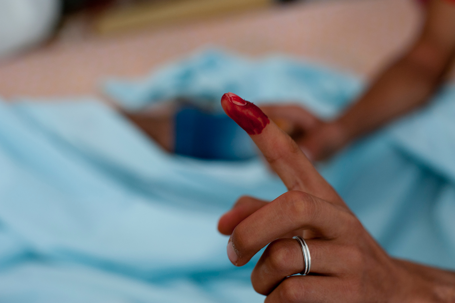  "We dipped our fingers in blood and made a sacrifice for Tunisia."
Zaed Garroui and the wounded made a symbolic vote, painting their fingers red to symbolize the blood they shed during the revolution.  