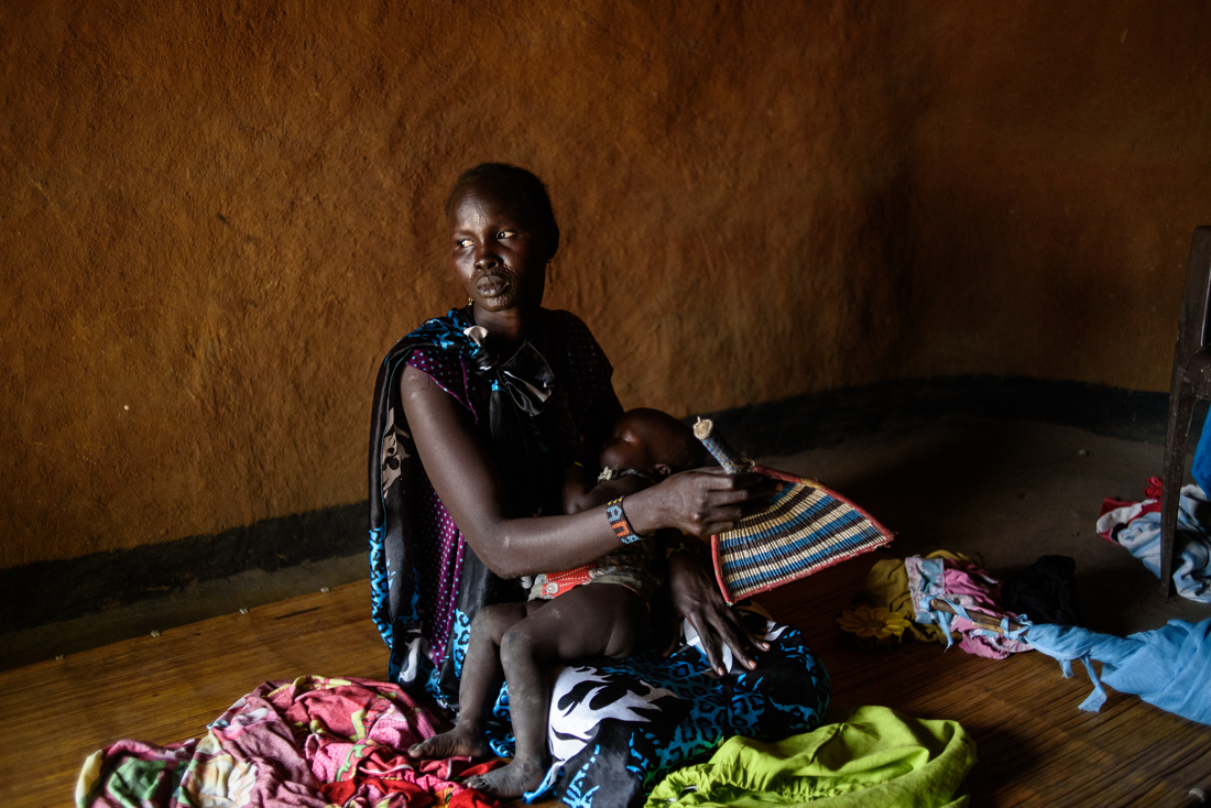  Angelina comforts her baby, Nyaladu

Angelina Nyadoang Juack, 38, and her family are from Nyal and her husband lives in an IDP camp in Juba. She has seen conditions in Nyal deteriorate over the years.  