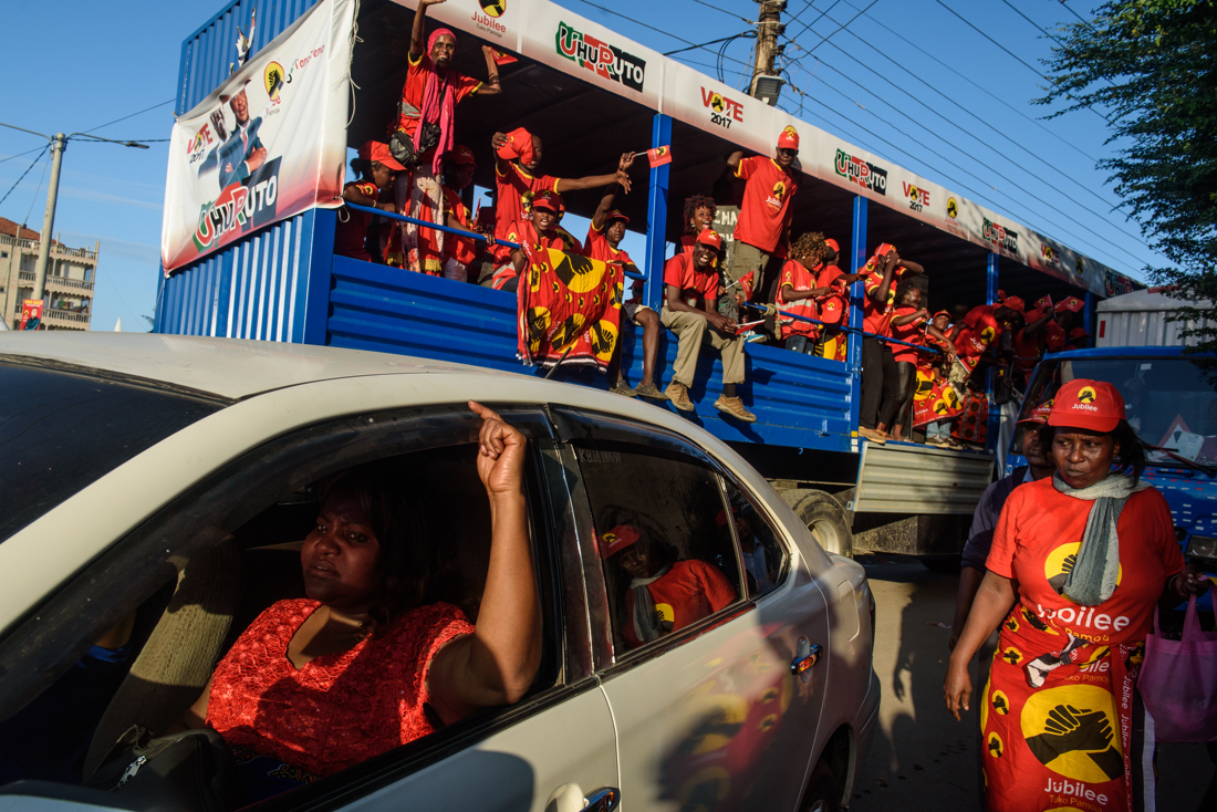  Jubilee party campaigners drive their bus away from the rally on 2 August 2017 at Tonanoka Stadium in Mombasa, Kenya. Kenyatta and running mate William Ruto seek a second term at State House. Kenyans go to the polls next week on 8 August in an elect