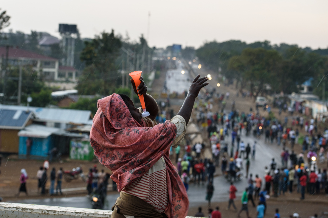  A woman blows a plastic horn as people celebrate NASA�s demand that Raila Odinga be declared president in Kisumu, Kenya on 10 August 2017. 

 