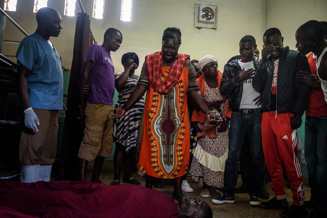  A family mourns the death of their son at the morgue in Kisumu, Kenya, where the bodies of men killed by police in the protests were kept. 
