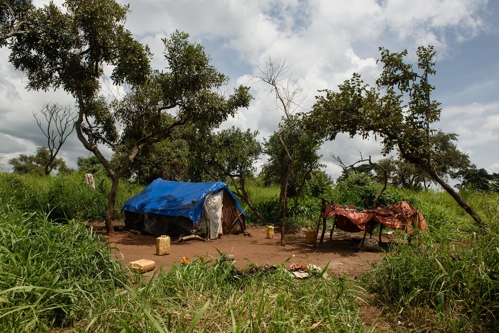  Kakande, 39, a charcoal burner, has been living in this camp in  Koch Lii for two years. He works on 32 hectares of land, burning  charcoal, cutting trees and hauling logs. “It’s extremely taxing work,” he  says. “I’m here because of poverty. Becaus