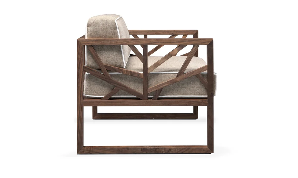 Tree is a comfortable & modern armchair with a solid walnut frame which brings visual lightness to the design.