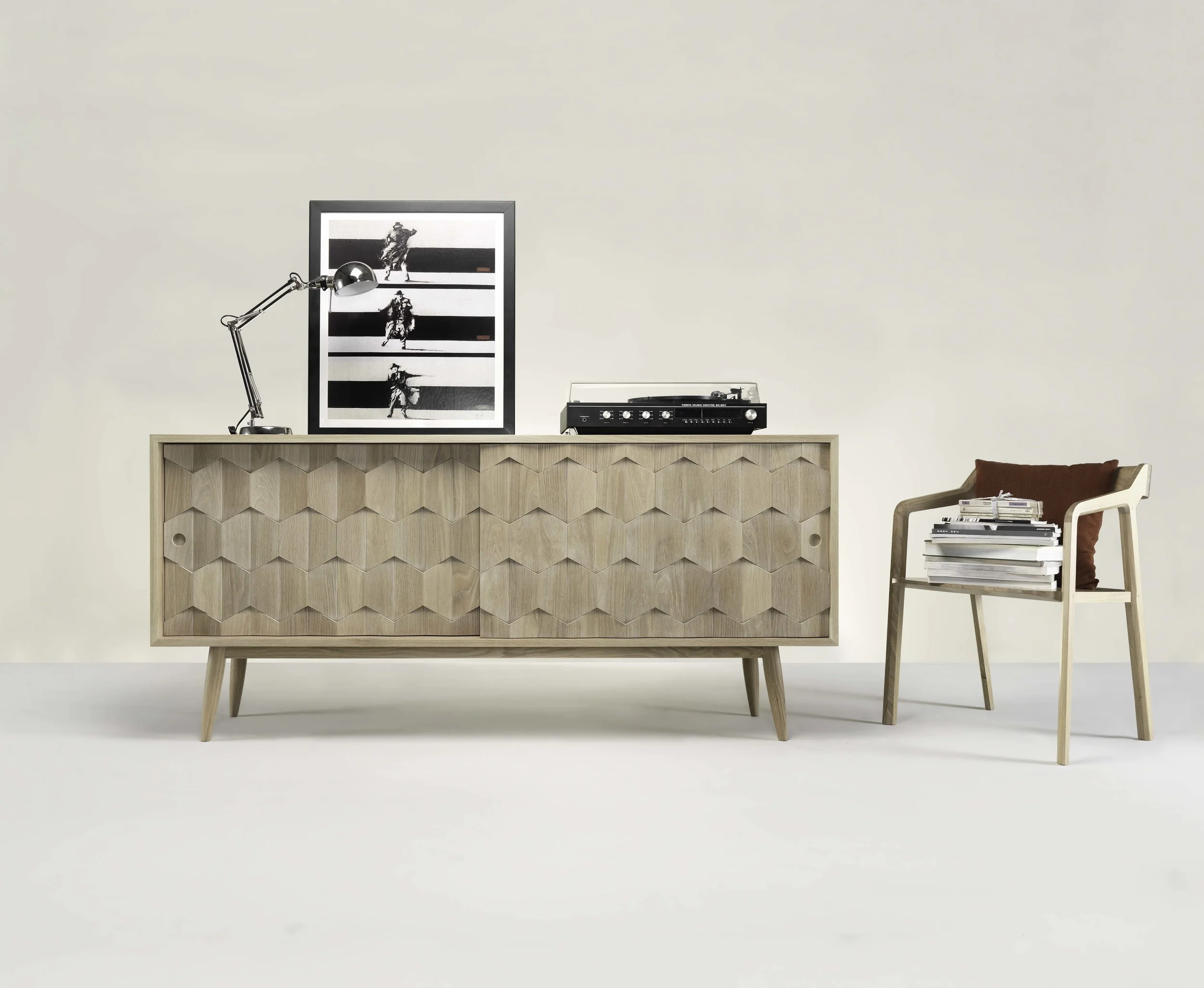 Crafted in lighter solid oak, SCARPA sideboard is the perfect blend between statement aesthetics and contemporary subtetly. SCARPA is one of the most eye-catching statement pieces, however its balanced and symmetrical design enables it to fit seamlessly into almost any interior.