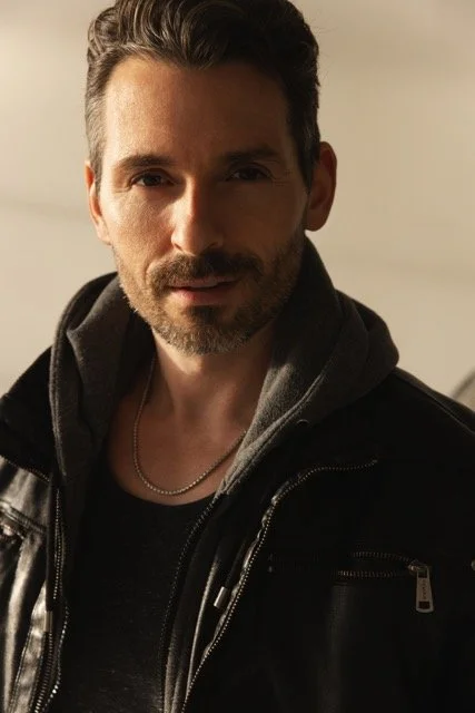 NicDetorie_EveningHeadshot Medium.jpeg