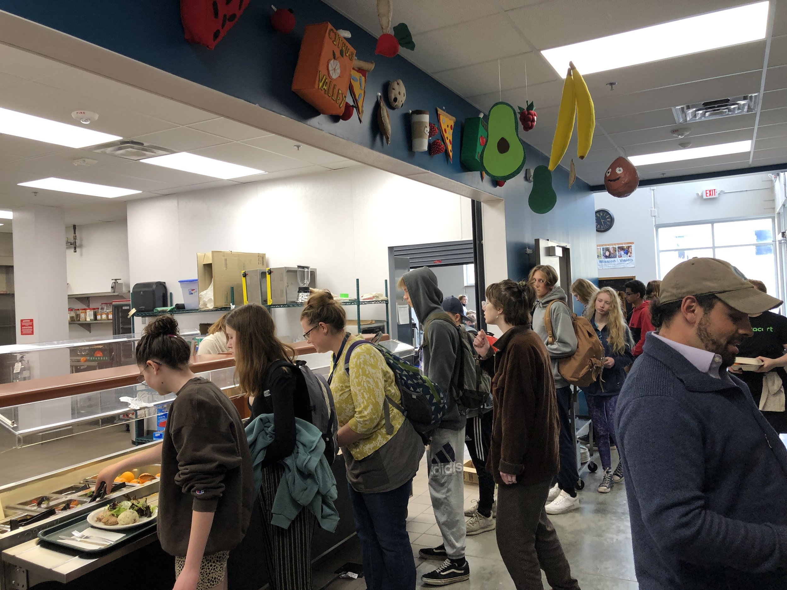 Adolescent students in Laura Machacek’s Sculpture elective created hanging food decorations to help beautify our kitchen environment.