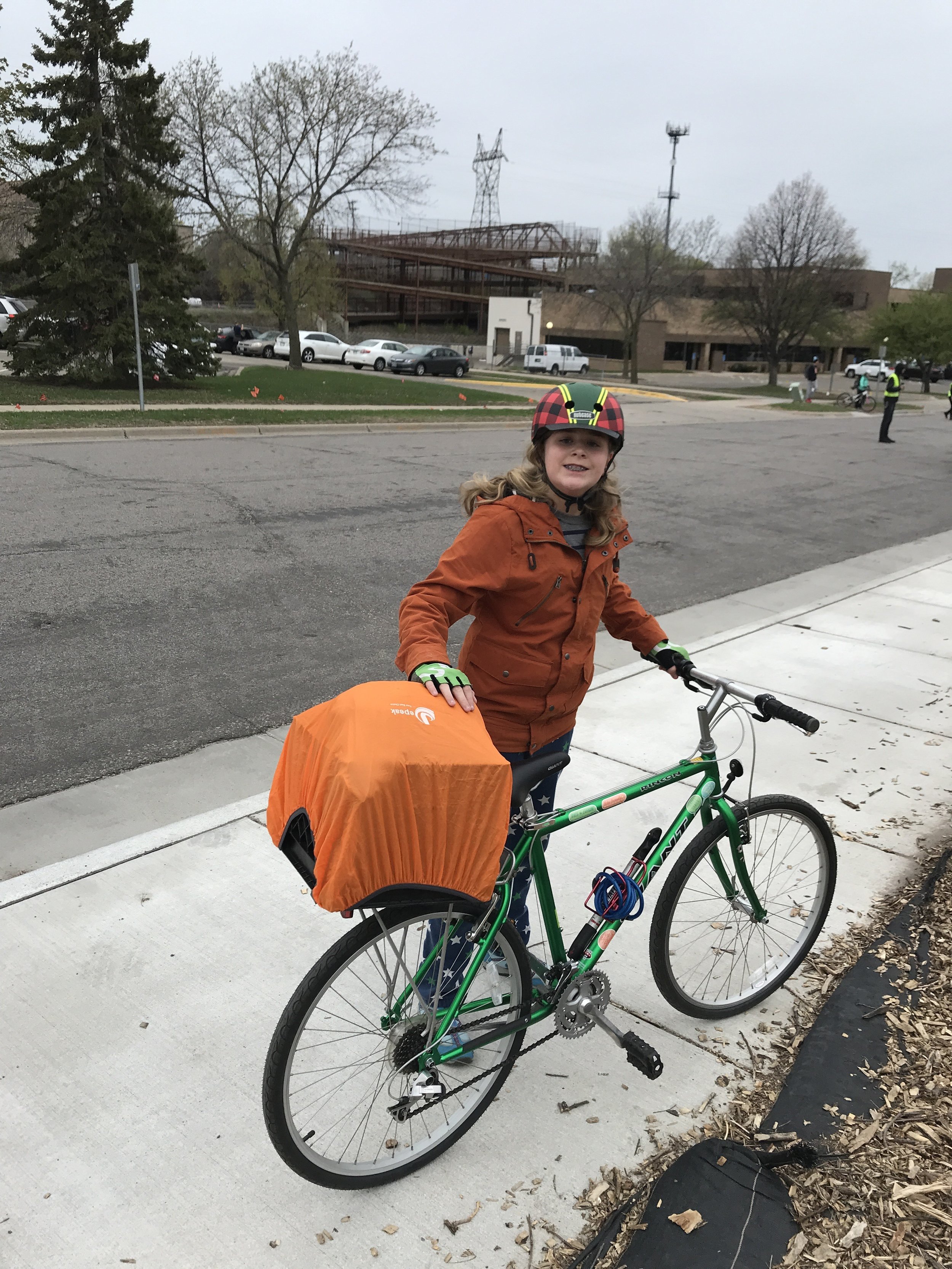 Everett Thomas models rain preparedness on a bike