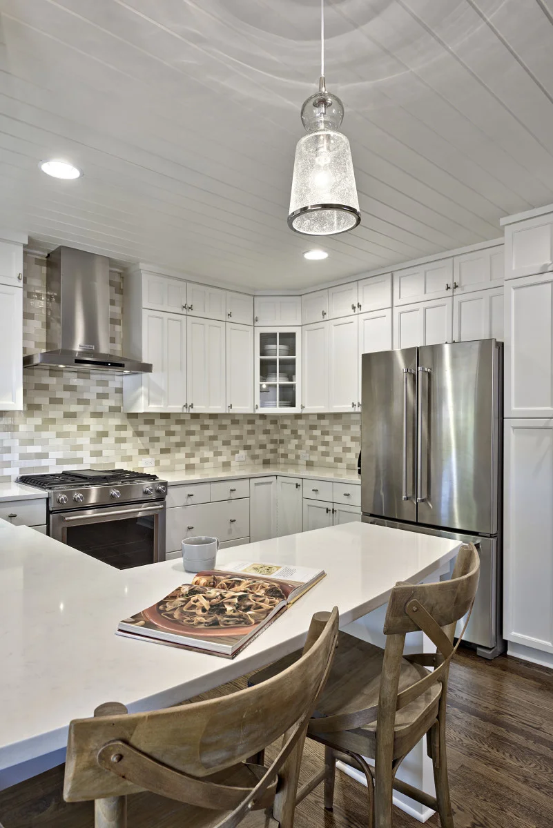 The bead board on the kitchen ceiling was painted a crisp white to give this craftsman style detail a fresh face-lift.
