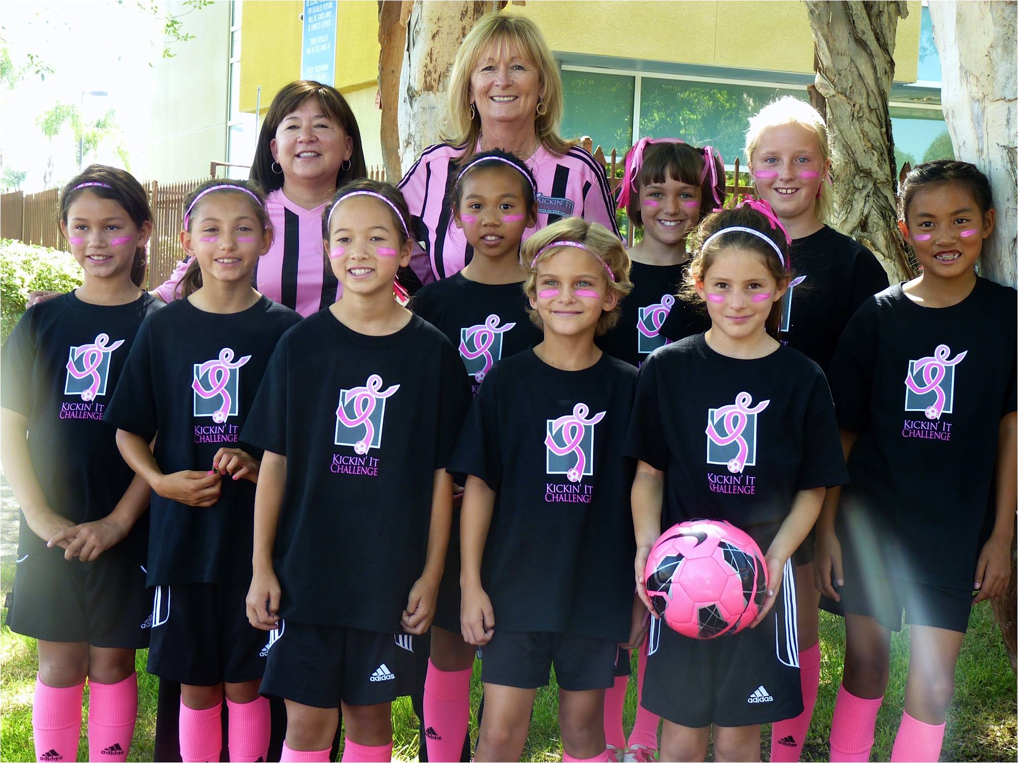 2013 - Pam Bickel, Kickin' It Challenge founder, and Tiffany Quackenbush, coach and breast cancer survivor, with the Poway Vaqueros GU10 Green team at a local news station.