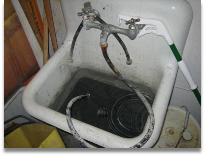 Deep sink with hose attached to faucet