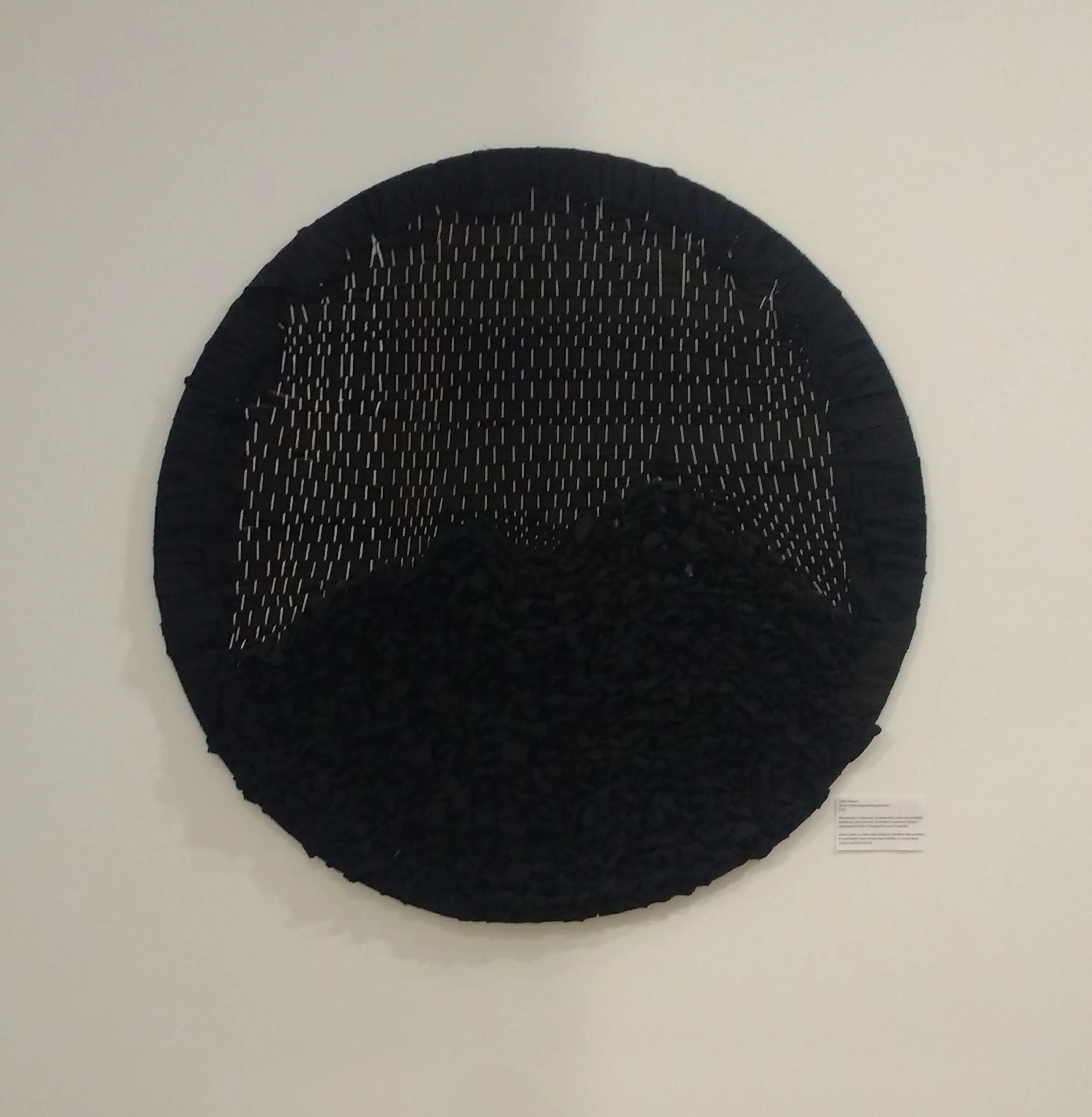 60% effaced. black circle weaving with white warp.