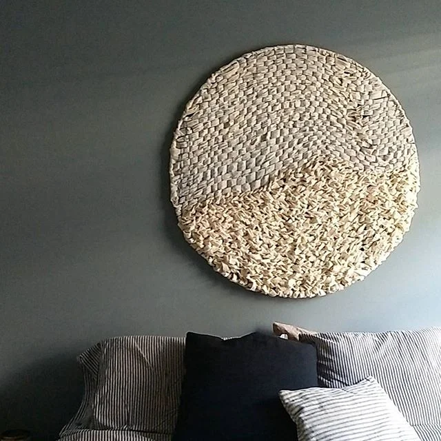 guru. large circle weaving in natural muslin.