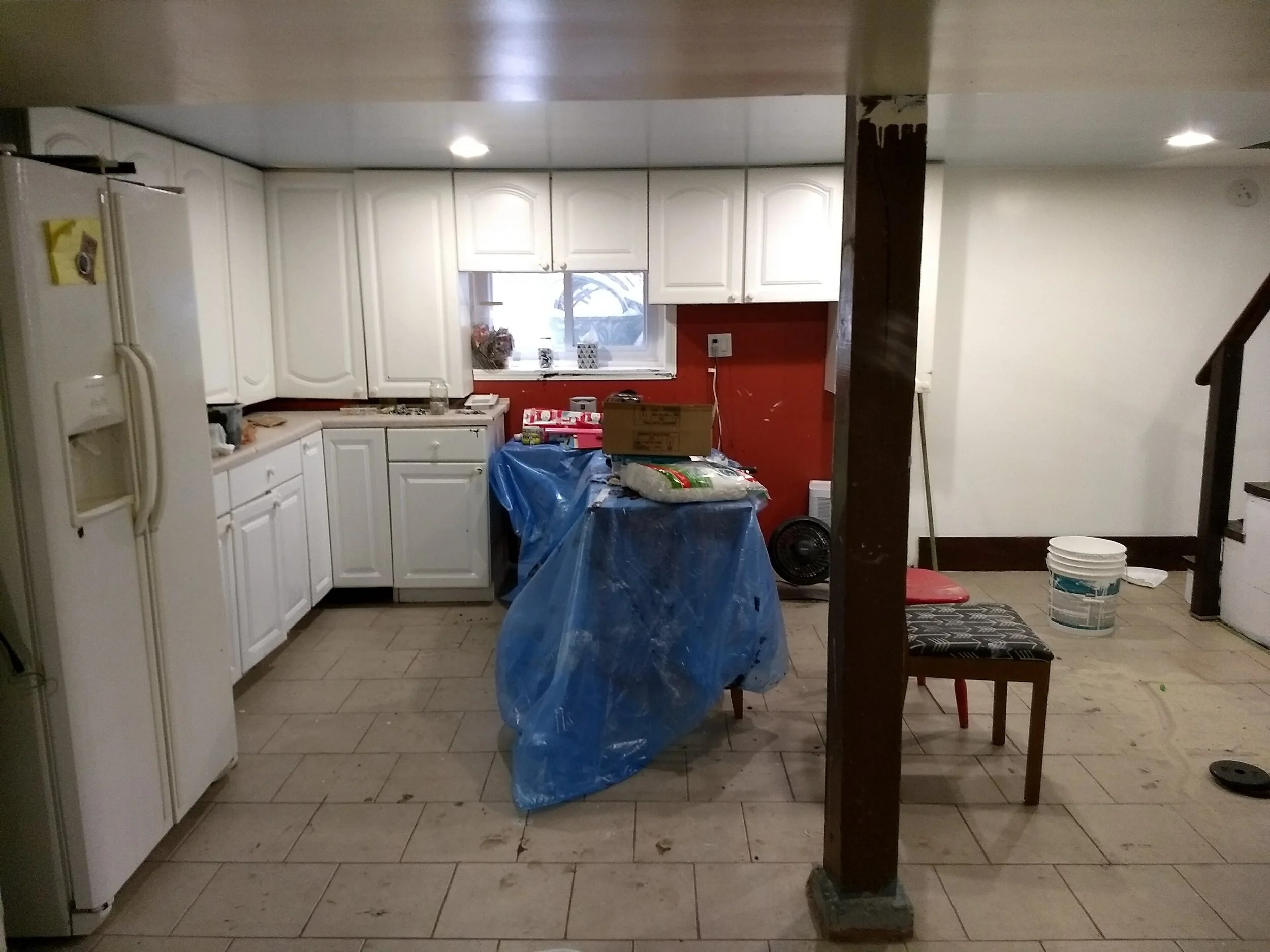 Same room, Before. Repurposed lower cabinets as workbenches.