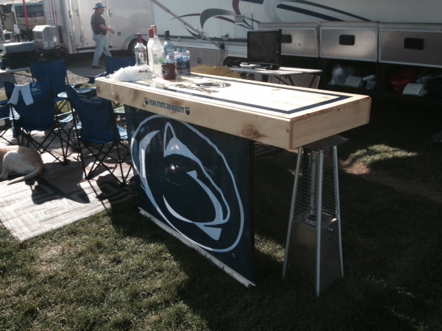 Some great tailgating neighbors who bought a bar... Nice touch to put the heater close! Chilly night is not stopping them!! Thanks for the purchase!!!