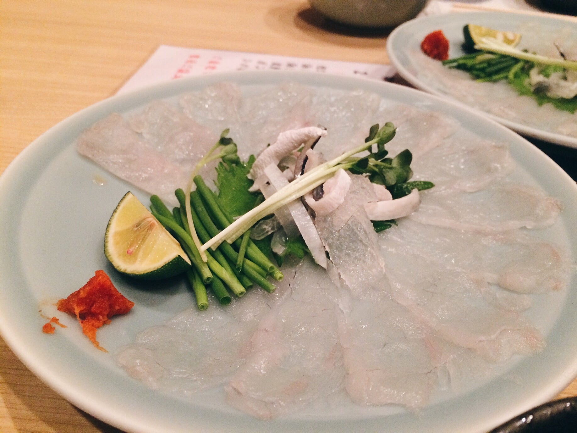 Fugu sashimi, taste pretty damn good! 