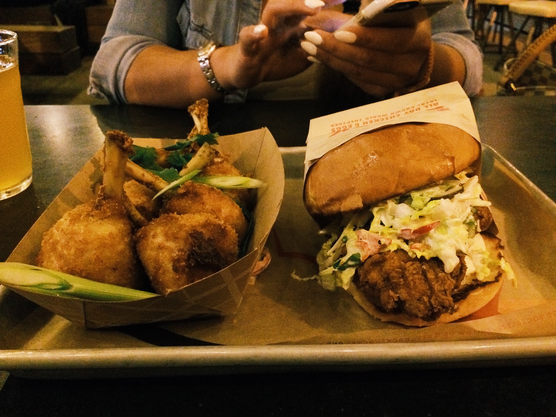 Chicken Lollipops and Coop Deville. It all comes down on what you order, not everything on the menu taste good. The lollipops was bland, but goes great with the dipping sauce they provide. They have 6 or 7 different sauces. The Coop Deville is a fried chicken sandwich which tastes pretty damn good. 