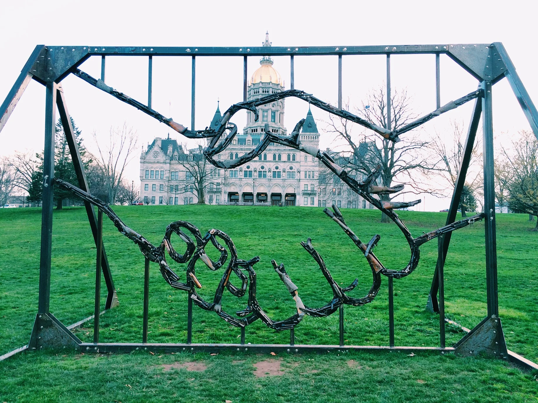 This art installation is hard, made of guns. Peace.