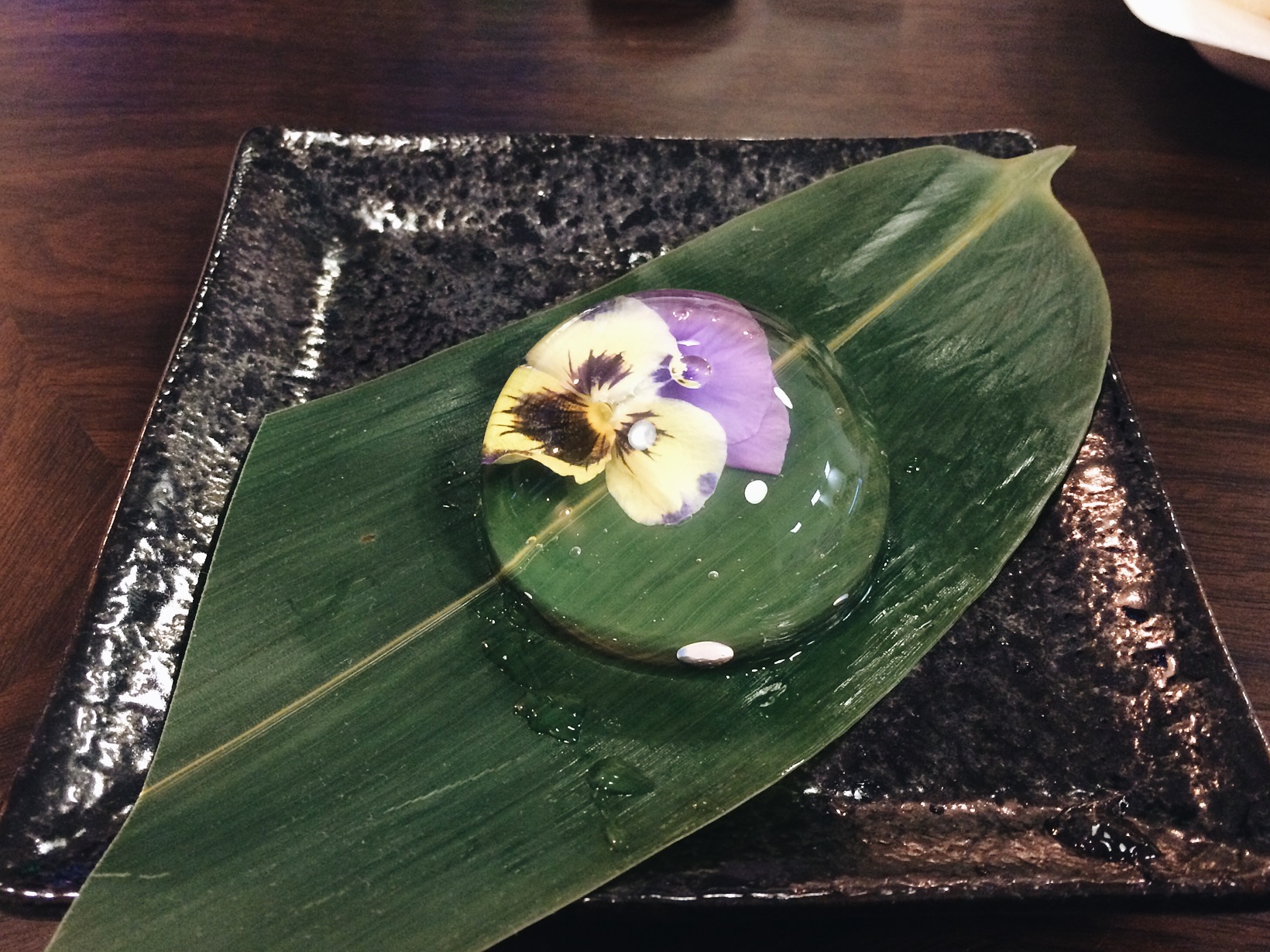 Rain Drop Cake. At first bite I was like, shit taste like a rain drop. It had no flavor, like I was actually eating water. But it came with syrup and some powder that you sprinkle on top of it and damn it was sweet! But good! very cool looking cake. 