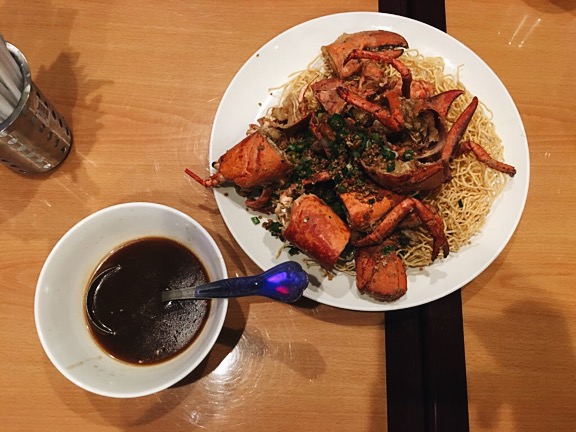 Here we have the Salt & Pepper Lobster on crispy noodles. Crack the sucker open and pour that brown sauce on top and it. 