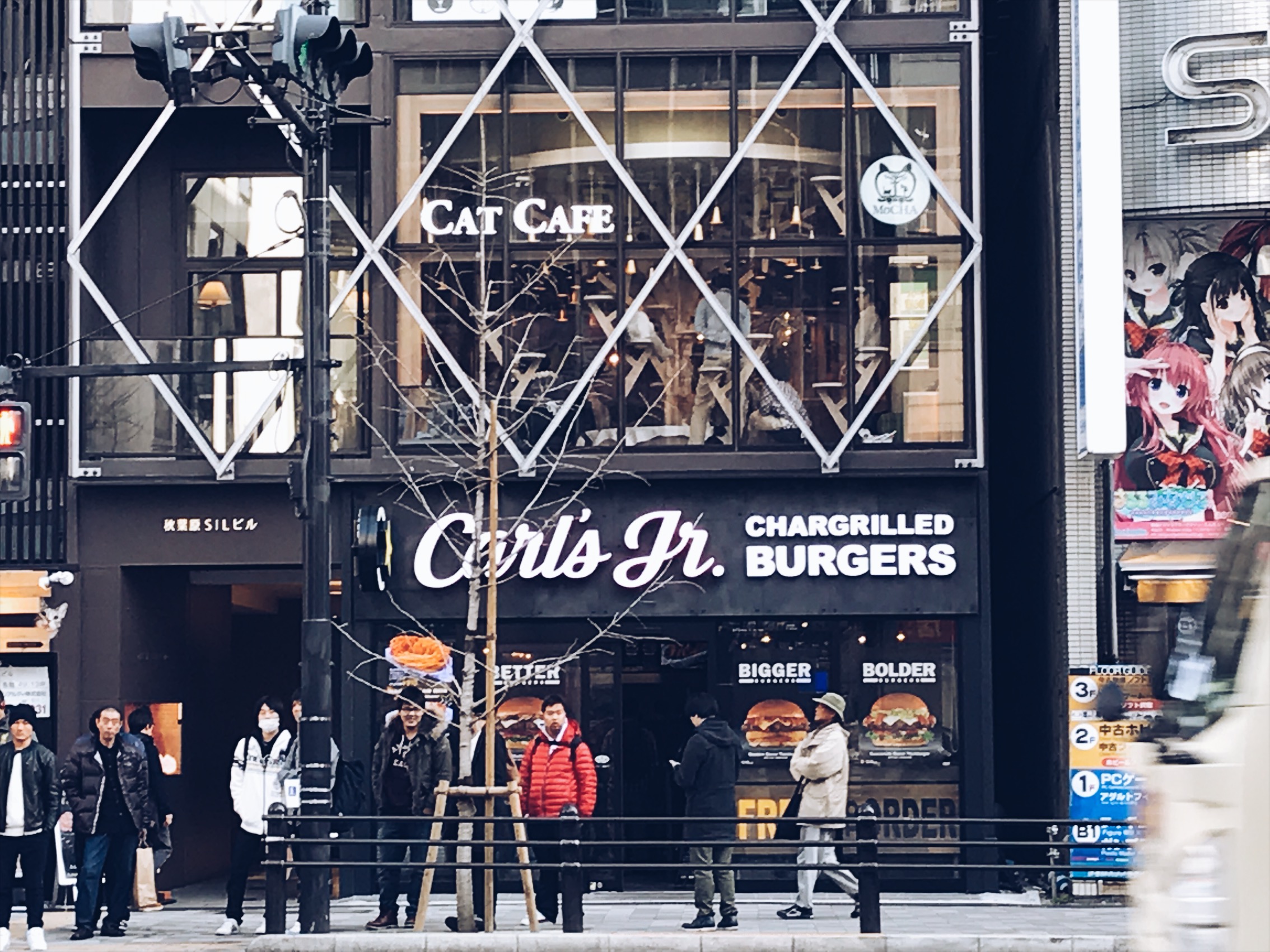While I was geeking over this Carl's Jr in Japan Gina comes banging on my shoulders in excitement. I turned around to see what the fuck she was soooooo excited about it and she points to the Cat Cafe haha. It cost money to get in and drink coffee or tea with some cats and you have to be in there for 30 mins. Since us guys have no interest in cats we went to the third floor for beer, and air soft guns!!!