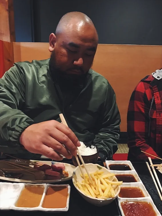 Love that he's keeping it Asian with the chop sticks here. 
