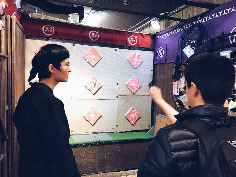 Yo! This kid just threw a ninja star in to the bulls eye!!!!! He has one in his hand if you don't know what's going on right now. Soooooo Japanese ! I love it! 