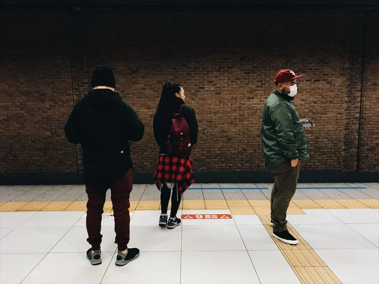 Catching the train to Dotonbori. 