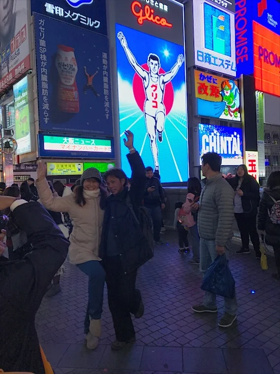 That running man in the back, whats the hype about this!? And The people posing in front it looked funny haha. 
