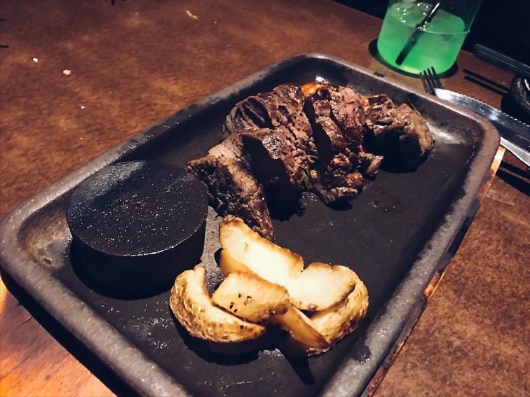 Rare steak, you can place the steak on that cylinder block to cook it. Caution: Extremely hot. 