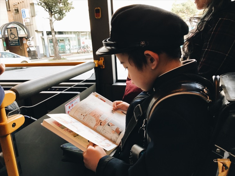 This kid walked up to my seat, stared at me. He was so cute! So I asked him "do you want to sit here?" He replied "yes." He speaks a little english. Then he asked, "are you Japanese?" I replied, "no, but here, have a seat."