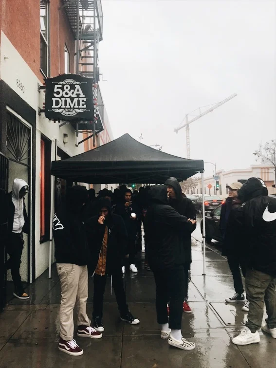 After everyone signed the waiver they were required to wait outside, under the shelter provided. Way too many people to hang out inside the store. 