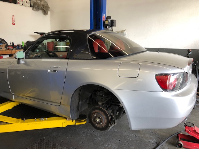 My brother next door installing new wheel studs for the new wheels.