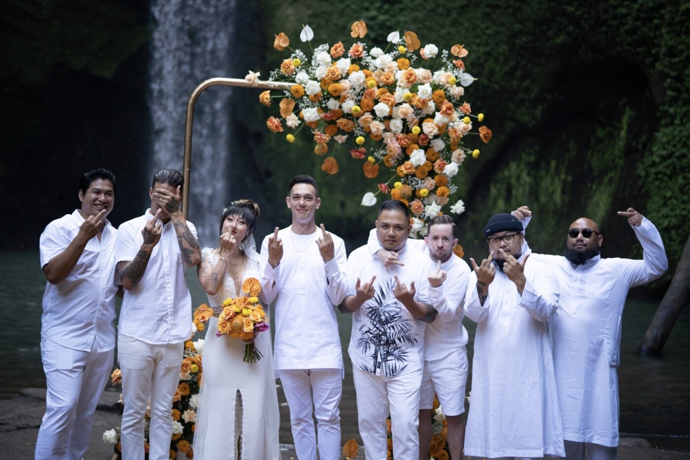 Not your typical wedding photo with those middle fingers lol. But I love it.