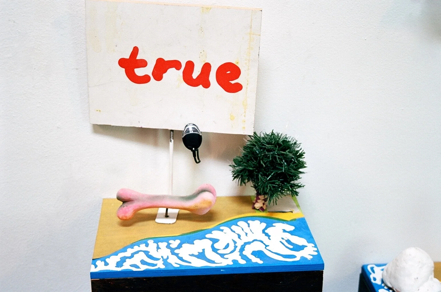   West Coast Intentions , ink, wood, sand paper, found objects, reading light, 24" x 18" x 12"   