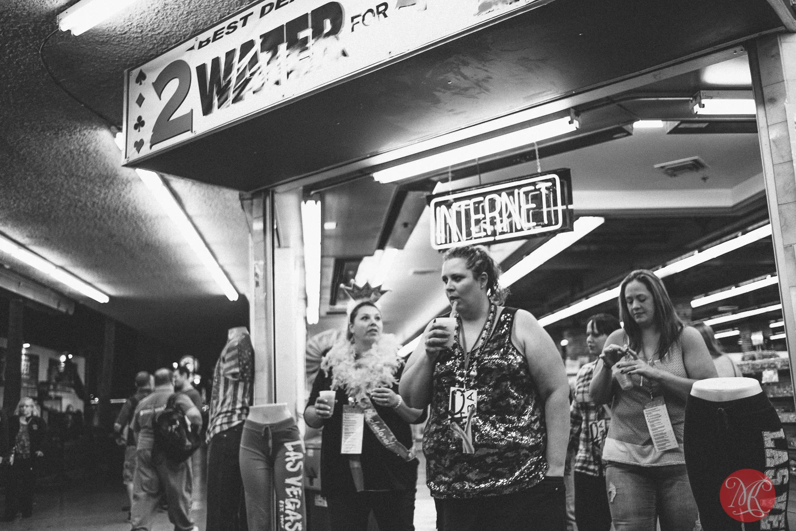 freemont street in Las Vegas women exiting a store having a drink