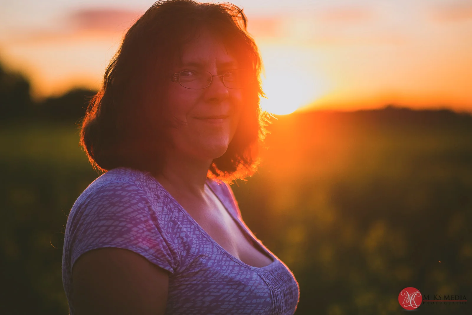 Alberta canola field sunset portrait of a woman