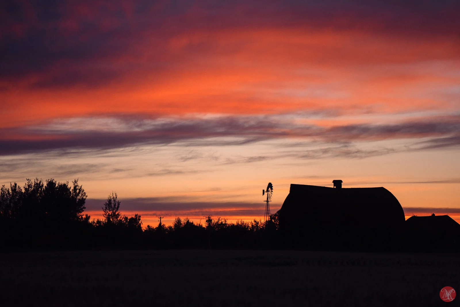 Alberta prairie sunset with abandoned farm
