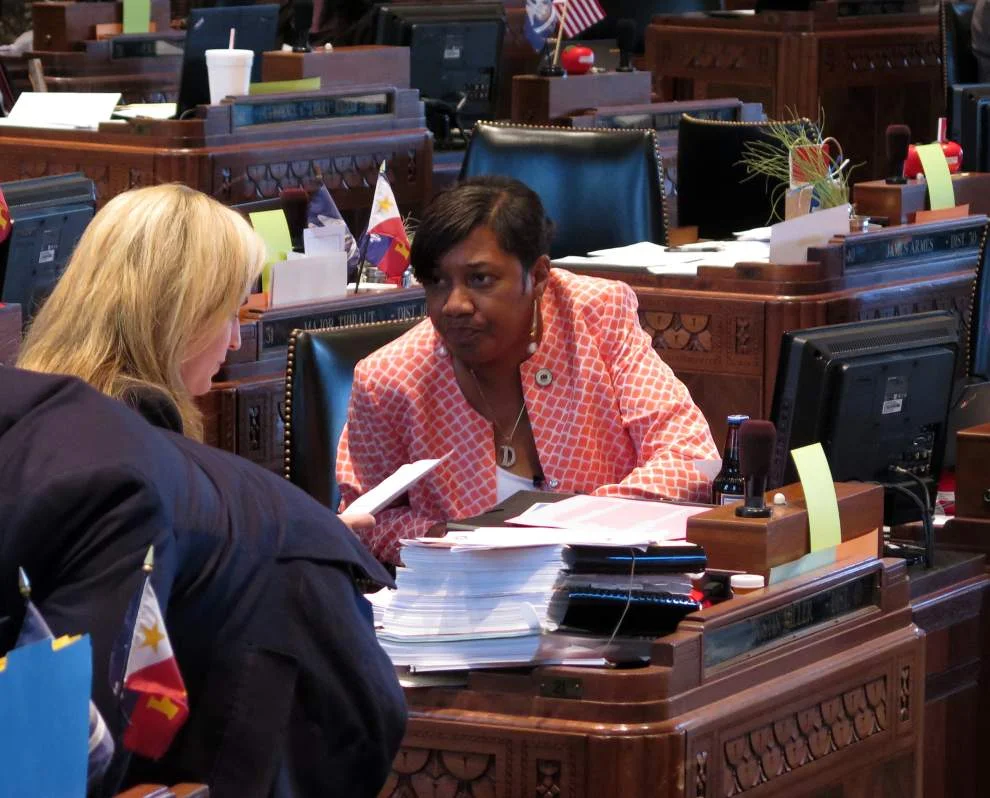 Advocate Photo by MARK BALLARD -- State Rep. C. Denise Marcelle, D-Baton Rouge, prepares Tuesday to present legislation to the Louisiana House that would give ex-convicts a better chance at landing a job interview with the state.